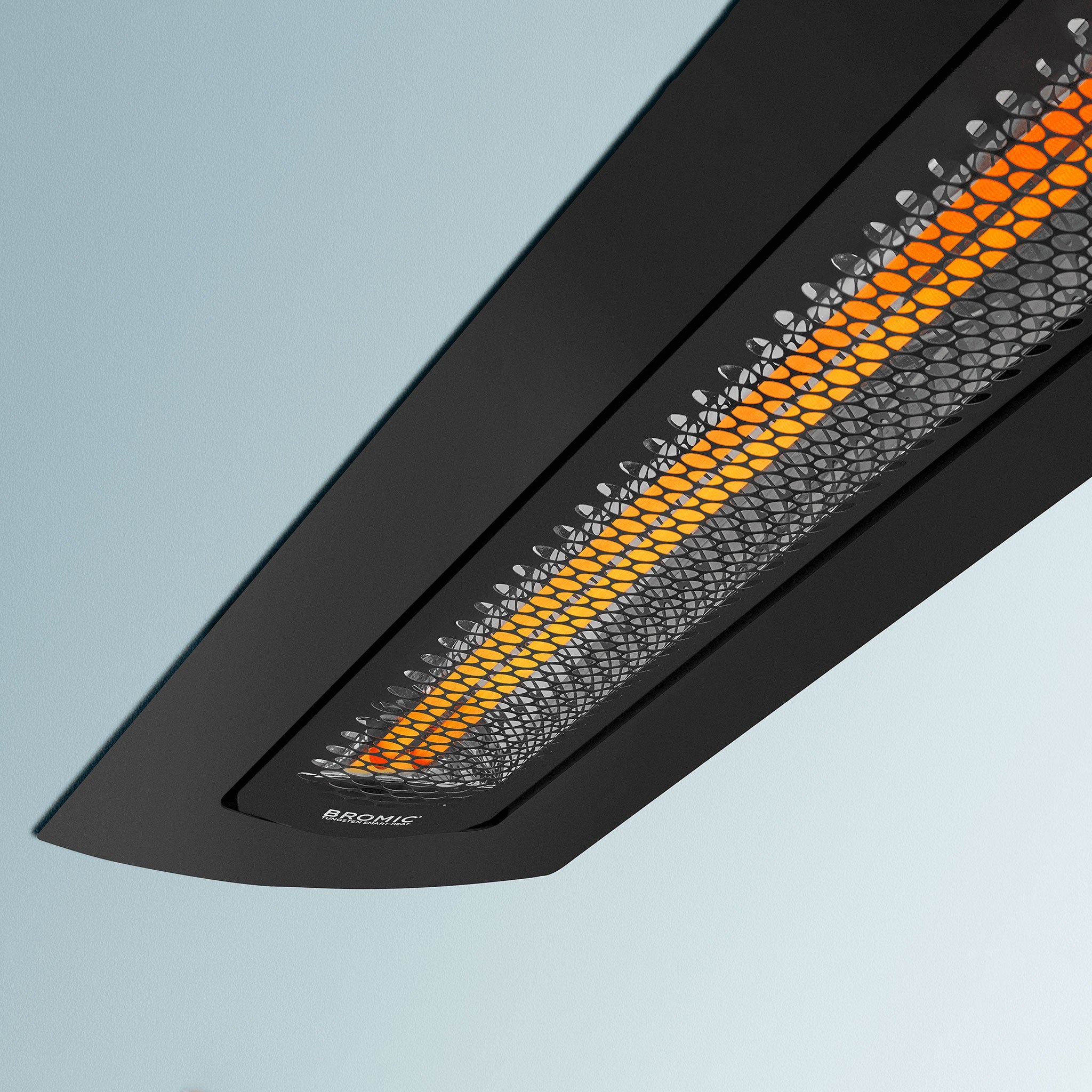 Close-up view of the Bromic Ceiling Recess Kit for Tungsten Electric Heater in black finish, showcasing its sleek, curved frame and precision vented design for flush-mount installations.